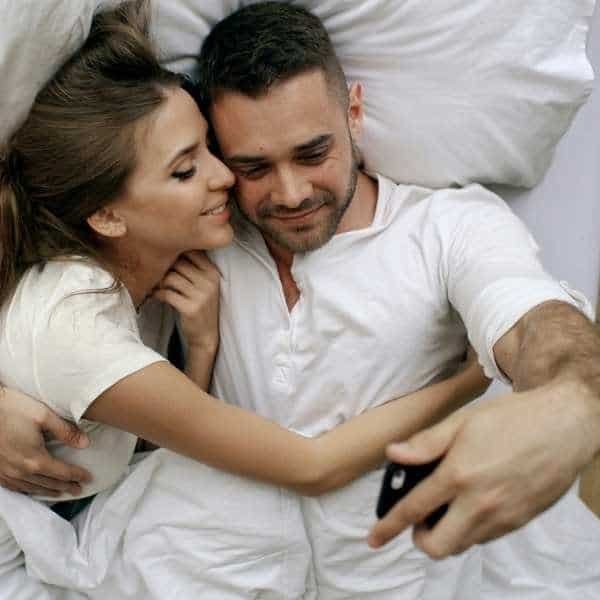 A happy, healthy middle-aged couple sharing a joyful moment, representing natural vitality and wellness from Himalayan supplements.